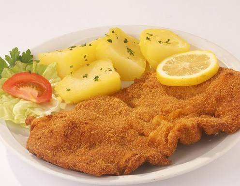 Wiener Schnitzel mit goldig knuspriger Panier.
