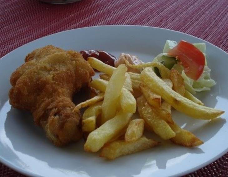 Gebackene Hühnerschenkel mit Pommes