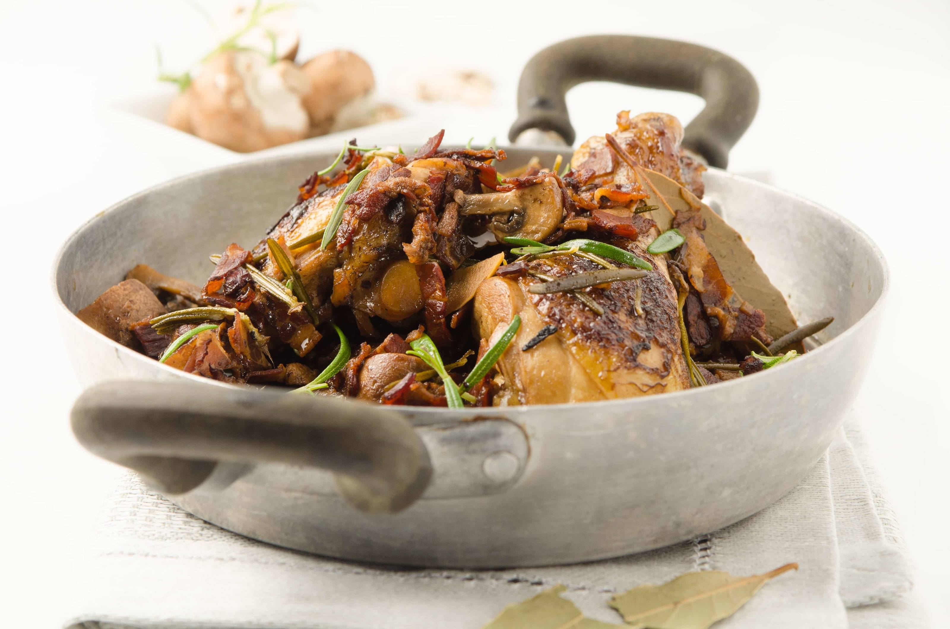 Hühnerkeulen mit Champignons Rezept