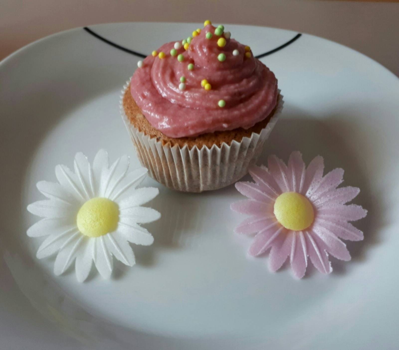Cupcakes mit Himbeerhauberl Rezept