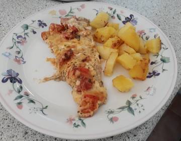 Überbackener Seelachs mit Cocktailtomaten Überbackener Seelachs mit Cocktailtomaten