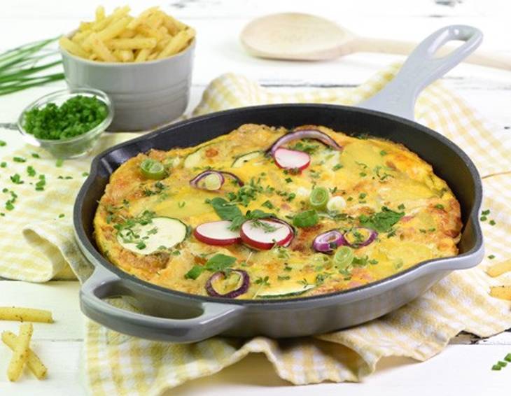 Mit Käse überbackene Gemüse-Schinken-Frittata