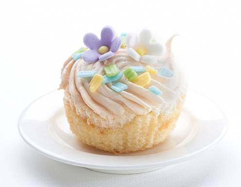 <p>Ein Cupcake mit wundersch&ouml;nen, pastellfarbigen Zuckerbl&uuml;ten.</p>