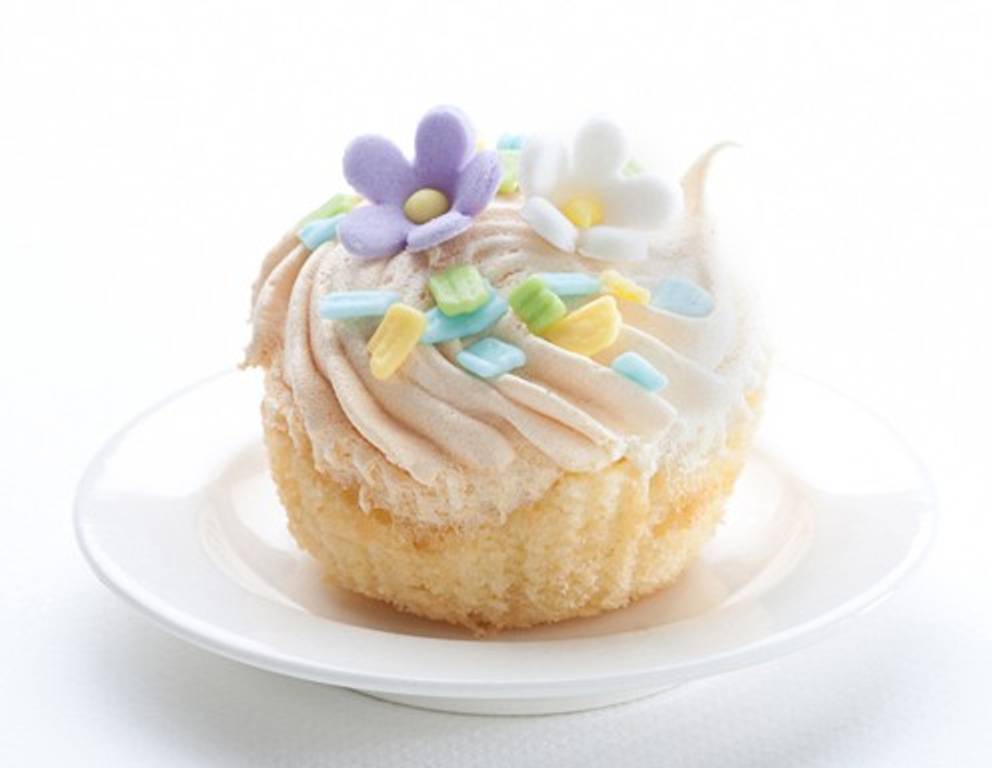 <p>Ein Cupcake mit wunderschönen, pastellfarbigen Zuckerblüten.</p> <p>Ein Cupcake mit wunderschönen, pastellfarbigen Zuckerblüten.</p>