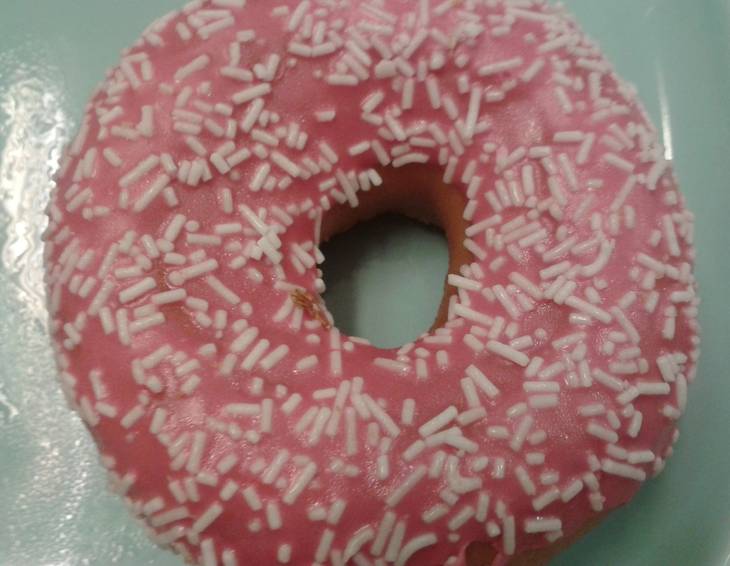 Donut mit Zuckerglasur Donut mit Zuckerglasur