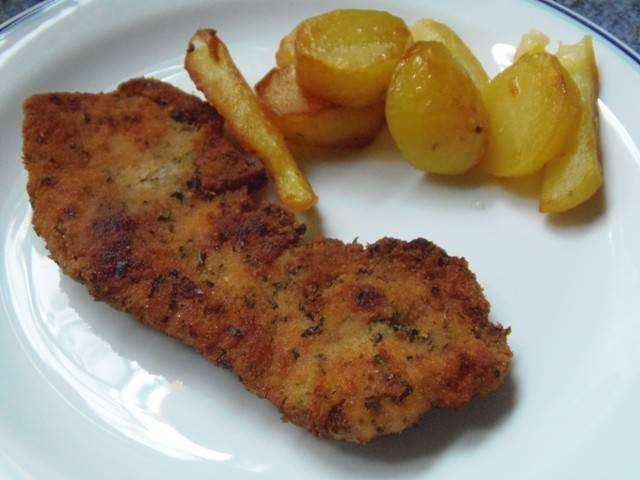 Schweinsschnitzel in Kräuterpanier Rezept - ichkoche.ch