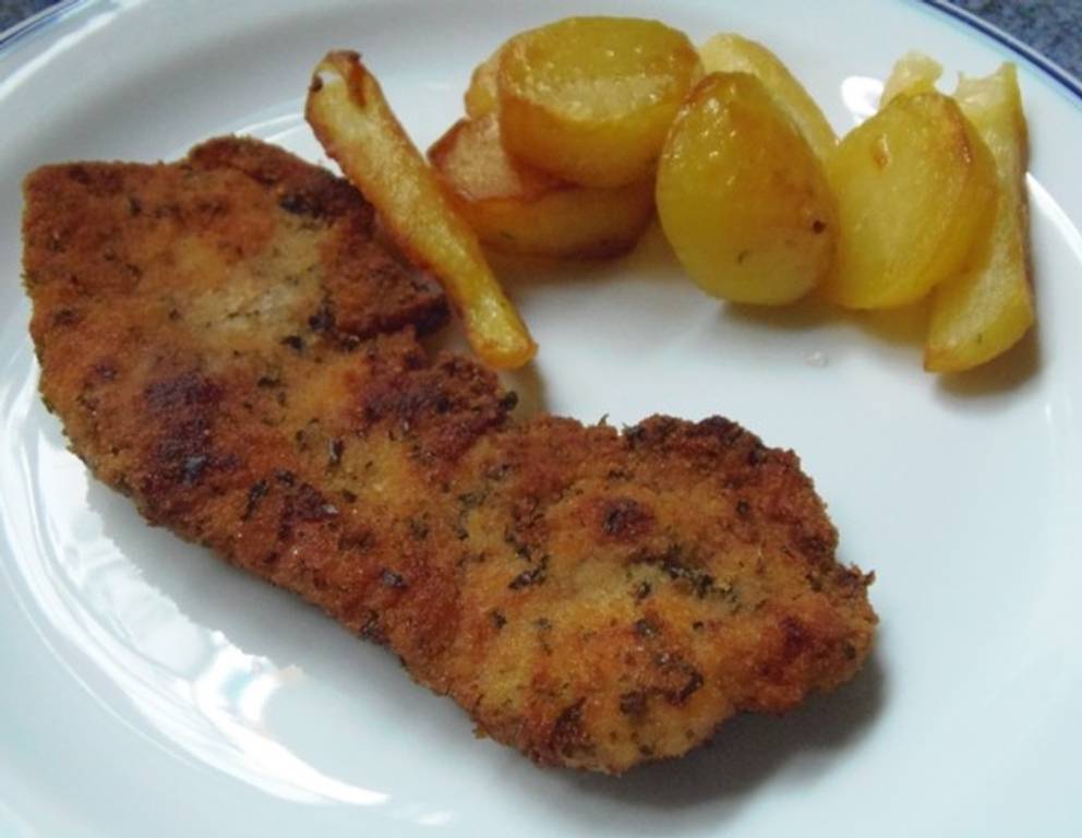 Schweinsschnitzel in Kräuterpanier Schweinsschnitzel in Kräuterpanier