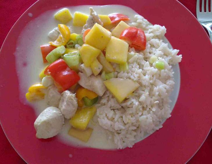 Putencurry mit Mango und Reis